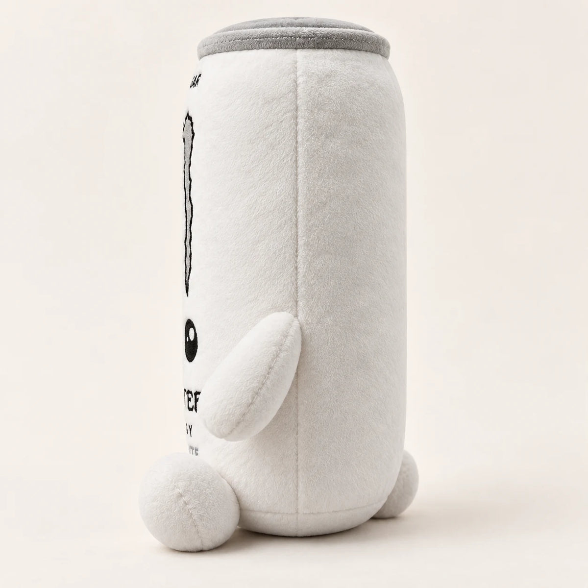 Peluche lattina bianca vista di profilo